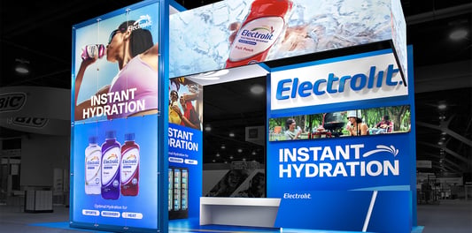 Electrolit trade show exhibit with large-format product graphics and vibrant high-contrast branding at NACS 2024