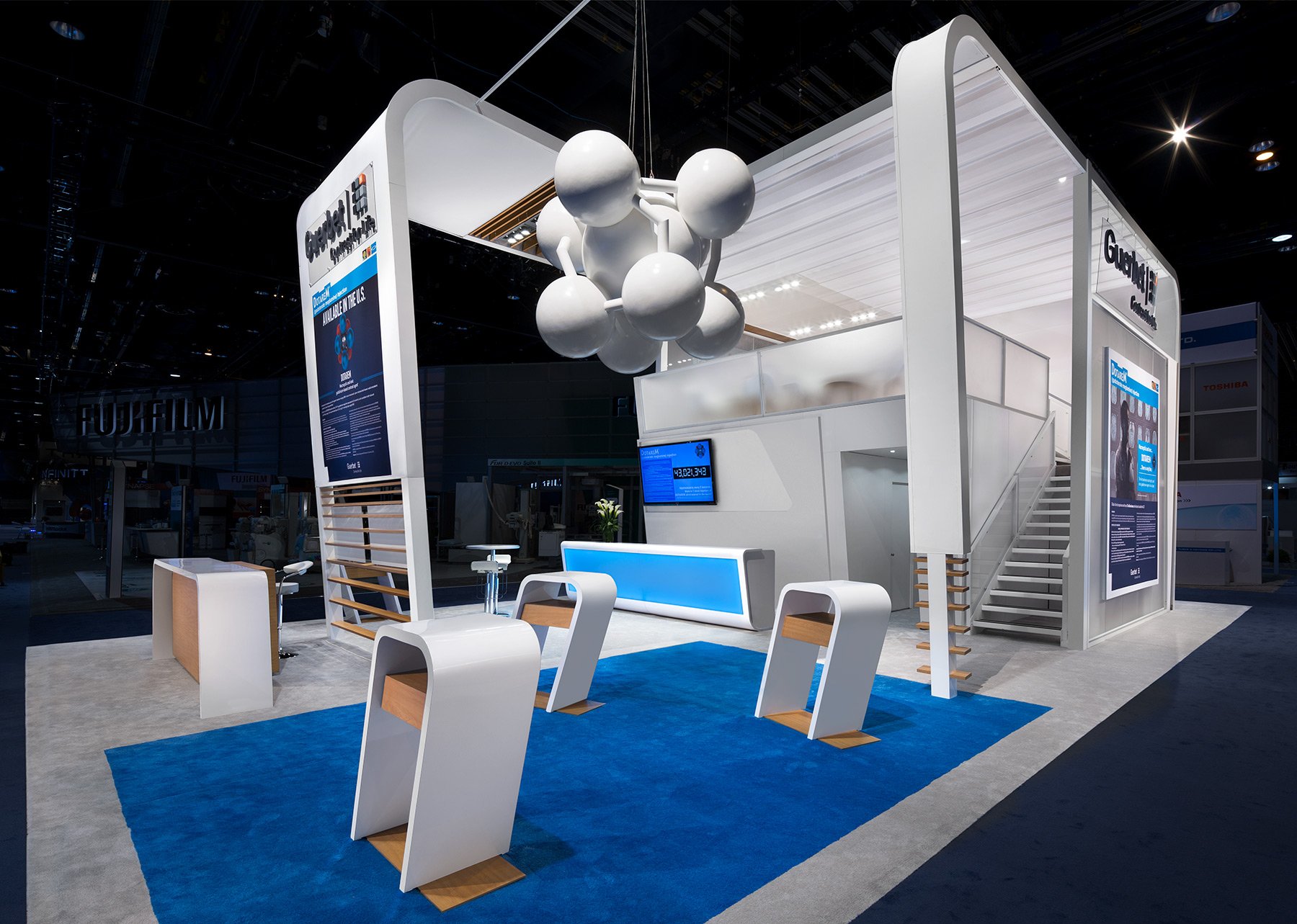 30x50 exhibit design at HIMSS showcasing healthcare demonstrations and modern booth architecture