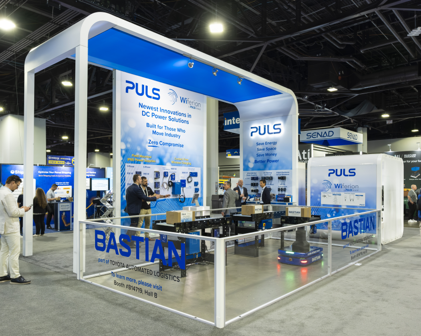 Material handling trade show booth with curved arch