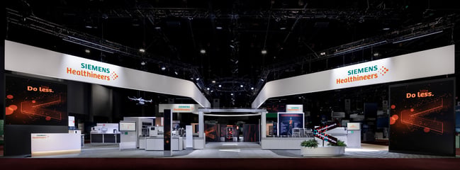 Siemens large rental trade show booth with custom dynamic architecture and product displays at ADLM 2025